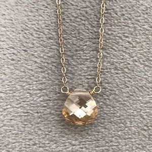 Gold necklace with iridescent crystal